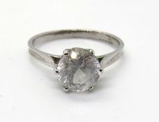 A white stone solitaire ring, indistinct marks, size P.