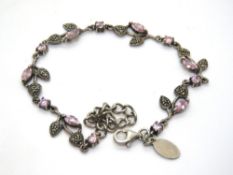 A 925 silver bracelet with pink stone and marcasite floral design.