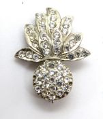 A silver and white stone brooch, stones deficient.