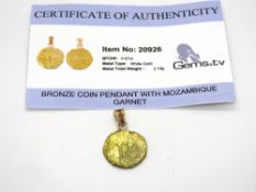 A Gems TV 'Bronze Coin' pendant set with garnets, total weight 2.