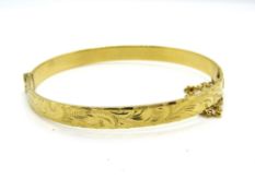 A vintage 9ct rolled gold hinged bangle, approx 5.9 x 5.3cm.