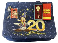 DISNEYLAND PARIS: A 20th anniversary tote bag, together with Cast-only memorabilia to include