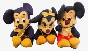 Three vintage Walt Disney toys, modelled as Mickey and Minnie Mouse