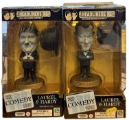 A pair of boxed limited edition Laurel and Hardy bobble-head figures by Equity Marketing. COAs to