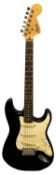 A Fender Squier electric guitar in black with white pick guard. Serial number: IC040934357 Wear