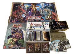 YU-GI-OH: A collection of various trading cards, game mat, card catalog and paper game sheets