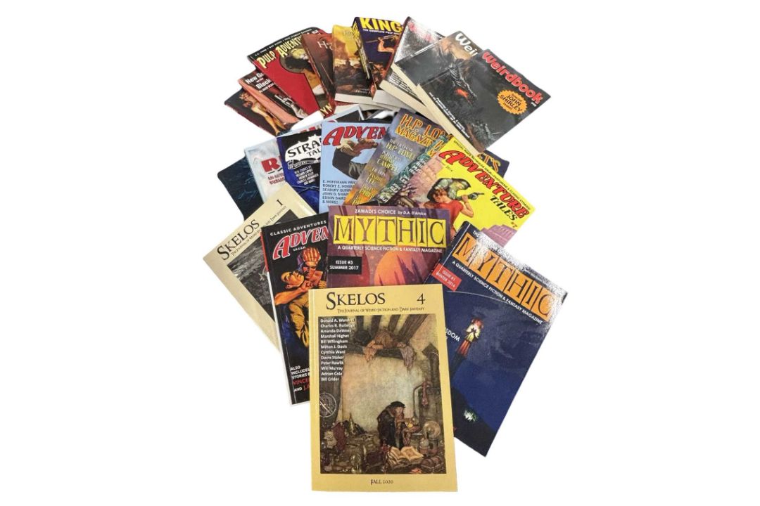 Box of pulp reprints and fantasy zines