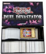 YU-GI-OH: One Duel Devastator box containing a large quantity of trading cards [not all cards shown,