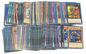 YU-GI-OH TRADING CARD GAME: A collection of various holographic cards.