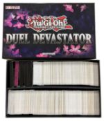 YU-GI-OH: One Duel Devastator box containing a large quantity of trading cards [not all cards shown,