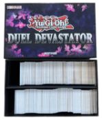 YU-GI-OH: One Duel Devastator box containing a large quantity of trading cards [not all cards shown,