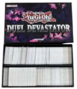 YU-GI-OH: One Duel Devastator box containing a large quantity of trading cards [not all cards shown,