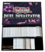 YU-GI-OH: One Duel Devastator box containing a large quantity of trading cards [not all cards shown,