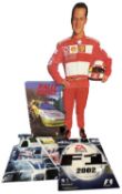 A michael Schumacher cardboard standee, together with various video-game advertising boards