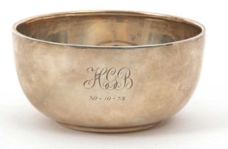 A George V silver sugar bowl of plain compressed circular form, initialled, hallmarked for Sheffield
