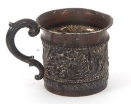 An Edwardian silver Christening mug, the centre band elaborately embossed with leaves, scrolls