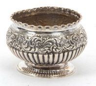 A late Victorian small silver pedestal bowl of slight compressed circular form having a crimped rim,