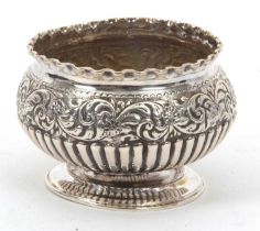 A late Victorian small silver pedestal bowl of slight compressed circular form having a crimped rim,