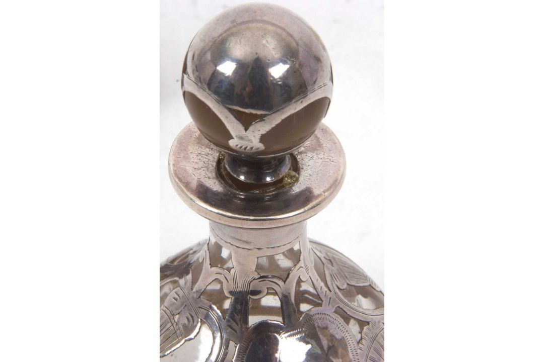 A Lalique, France Nina Ricci mini perfume bottle of wrythen turned form with a glass dove stopper, - Image 3 of 3