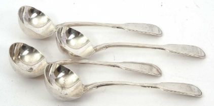 Four Victorian fiddle and thread pattern sauce ladles, each engraved with a crest, hallmarked London
