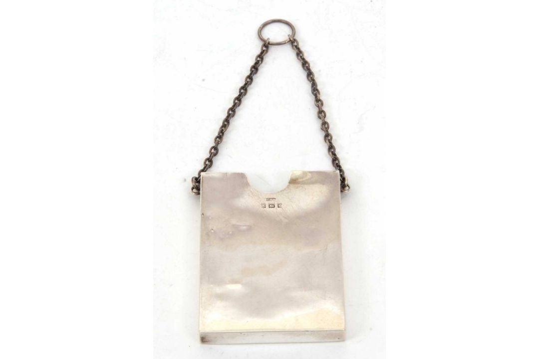 An Edwardian silver card holder of plain rectangular form, suspended from a silver oval link chain - Image 1 of 6