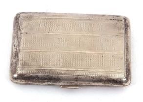 A George V silver cigarette case of rectangular form with all over engine turned banded