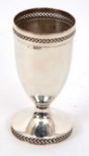 A George VI silver goblet of vase form having a geometric pierced rim to a spreading circular