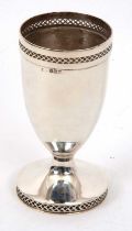 A George VI silver goblet of vase form having a geometric pierced rim to a spreading circular