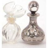 A Lalique, France Nina Ricci mini perfume bottle of wrythen turned form with a glass dove stopper,