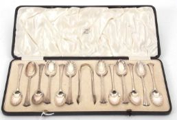 A cased Victorian silver Onslow pattern set of twelve teaspoons and matching tongs, having fluted