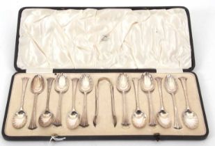A cased Victorian silver Onslow pattern set of twelve teaspoons and matching tongs, having fluted