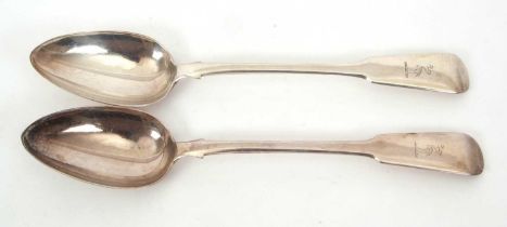 A pair of George IV silver fiddle pattern basting spooons, engraved with a crest, hallmarked for