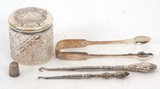 Mixed Lot: A pair of George III silver fiddle pattern sugar tongs, hallmarked for London 1810,