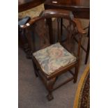 A small Georgian mahogany child's corner chair with bow back, pierced splats and a front cabriole