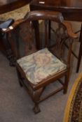 A small Georgian mahogany child's corner chair with bow back, pierced splats and a front cabriole