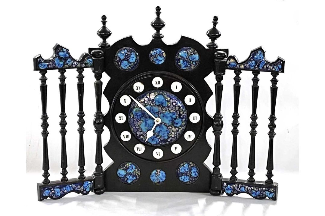 A 20th Century Spanish mantel clock with ebonised frame and enamelled panels, bearing label to the - Image 1 of 4