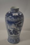 A Chinese porcelain vase, late 19th Century decorated in Kangxi style with Chinese figures in a