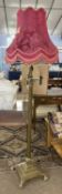 A 20th Century brass Corinthian column type standard lamp raised on a stepped square base with paw