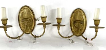 Two brass wall lights with candle type sconces