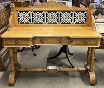 A late Victorian aesthetic style wash stand or hall table with tiled back over a body with three