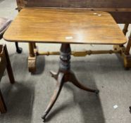A Georgian mahogany supper table, the rectangular top over a turned column and tripod base with