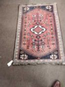 Small Hamadan rug or prayer mat decorated with a large central red lozenge, 102 x 75cm