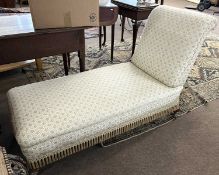 A late 19th Century day bed with pale floral upholstery