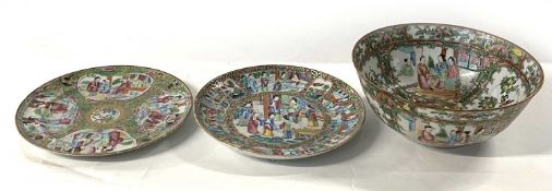 A Cantonese porcelain bowl with typical decoration together with two Cantonese plates, the bowl 21cm