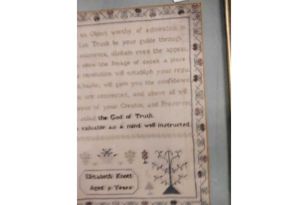A needlework sampler decorated with a stylised floral border and rows of religious text singed - Image 2 of 4