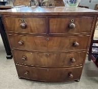 A Victorian mahogany chest of two short over three long drawers, fitted with turned knob handles,