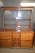 A large George III oak mule chest with hinged lid over a body with drawers, dummy drawer fronts