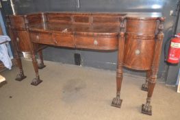 A large Scottish Regency serving sideboard, the drop centre body with large central drawer and two