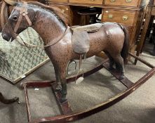 A small 19th Century rocking horse, the body with brown dappled decoration painted on what appears