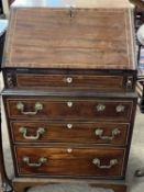 Georgian style mahogany bureau of small proportions, the fall front opening to a fitted interior